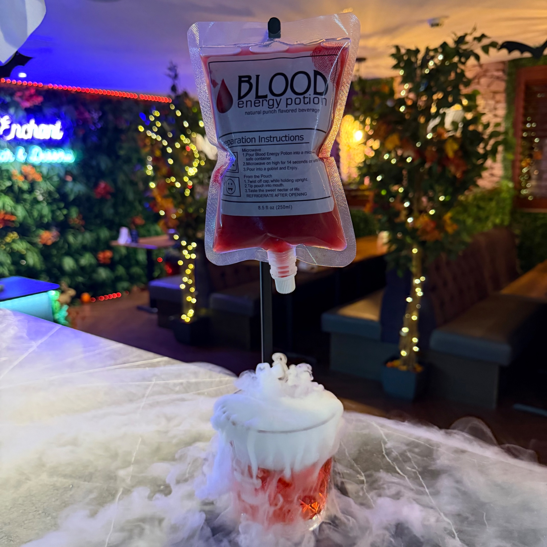 Blood energy potion pouch dripping into a smoking cocktail at Enchant