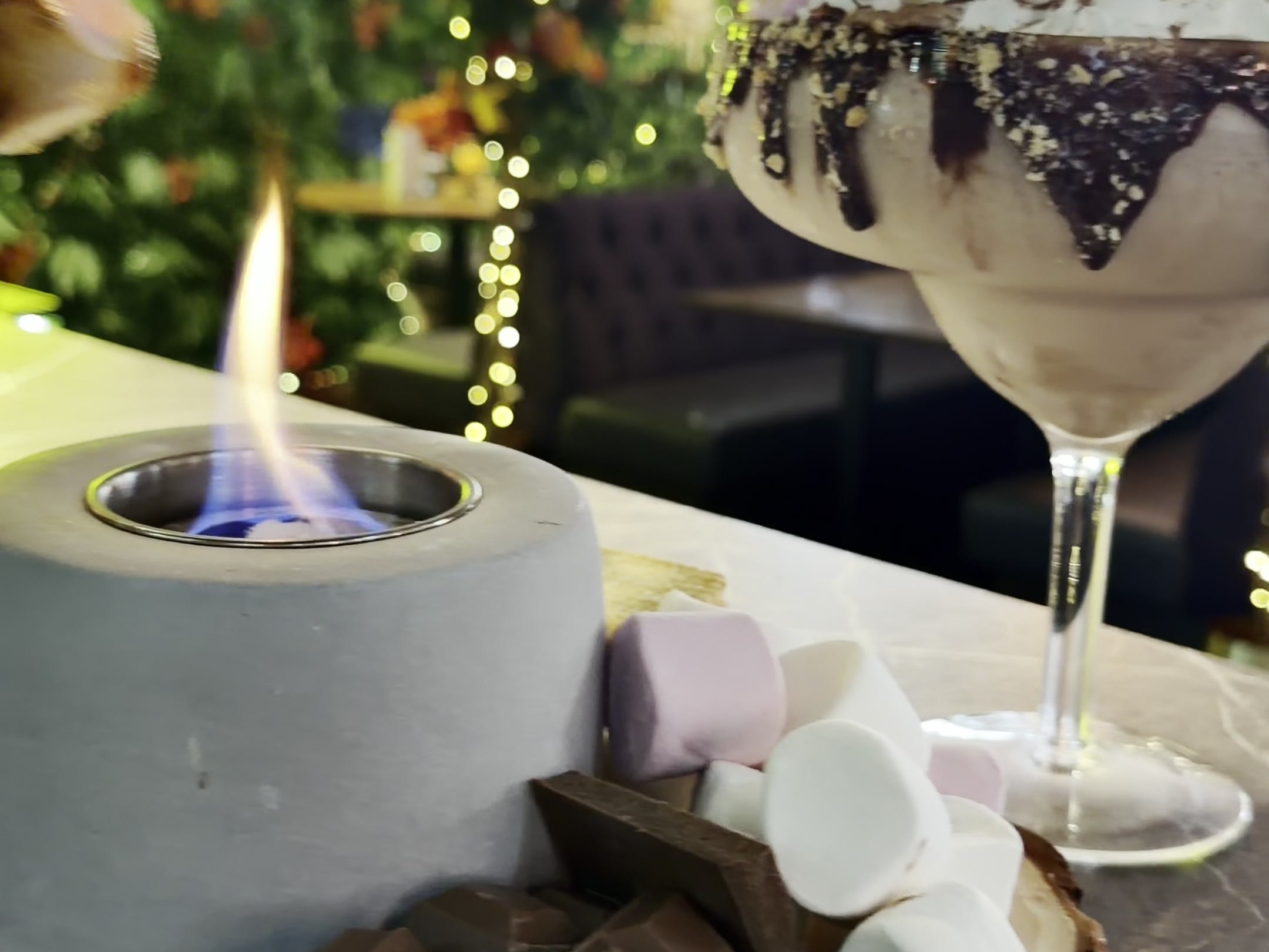 The Giant S'mores Martini with a tabletop campfire at Enchant Bar