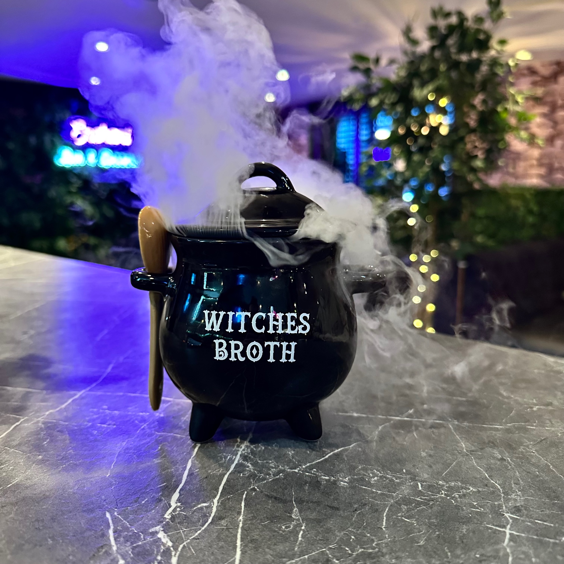 Witches Broth cauldron cocktail steaming with dry ice at Enchant