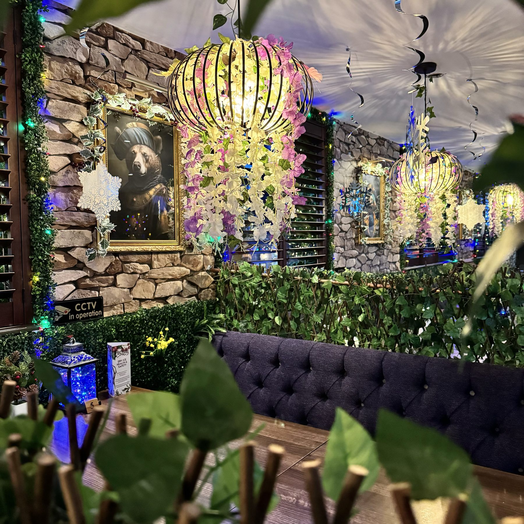 Inside Enchant's enchanted forest seating area
