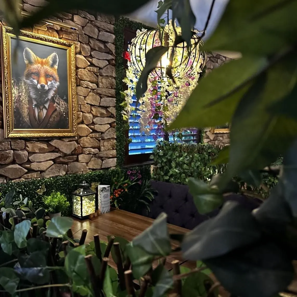 Inside Enchant's enchanted forest seating area