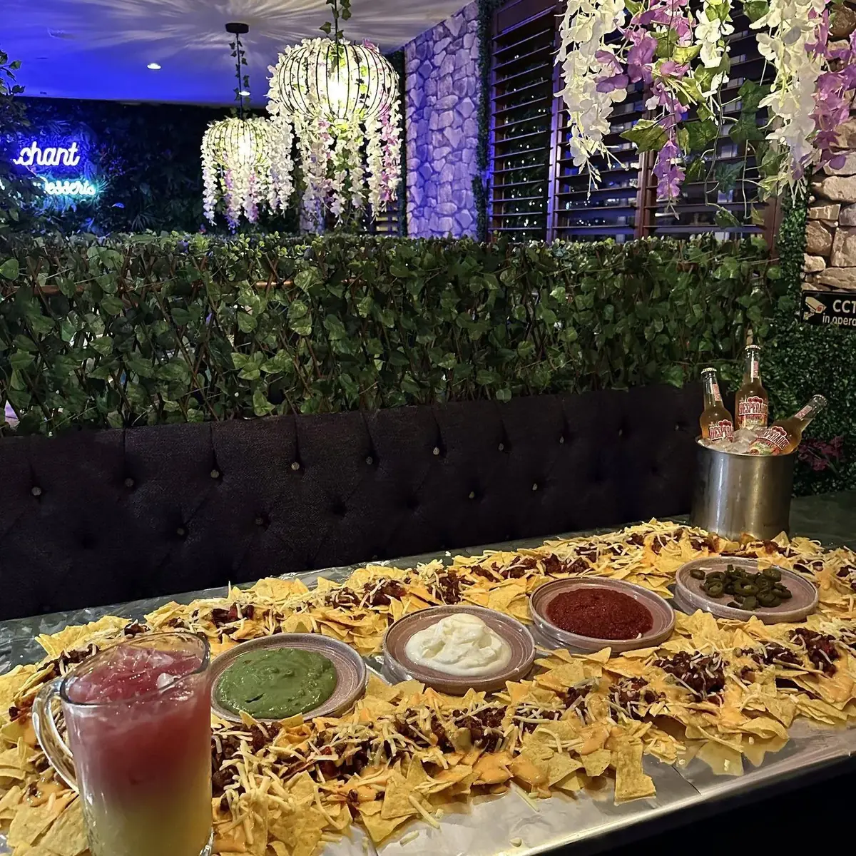 Nacho table with cocktails along its length