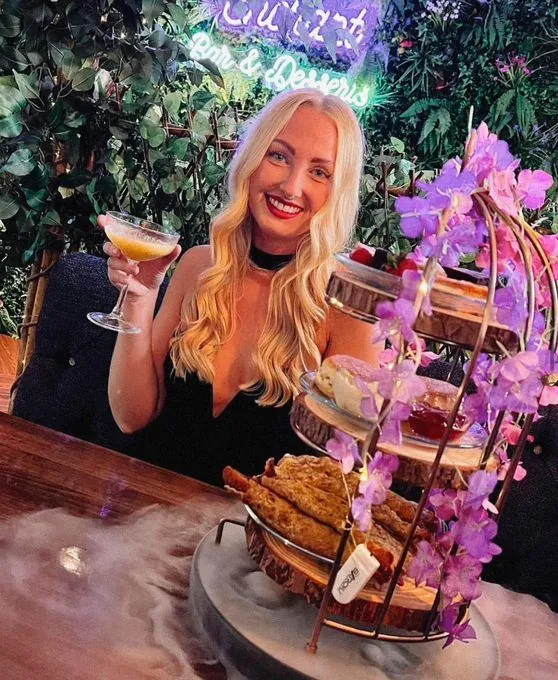 Guest enjoying a pink-themed afternoon tea